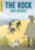 Person with dog on a beach watches three figures in wetsuits emerging from the sea. Sky is overcast. Text reads "The Rock Ann Bryant."